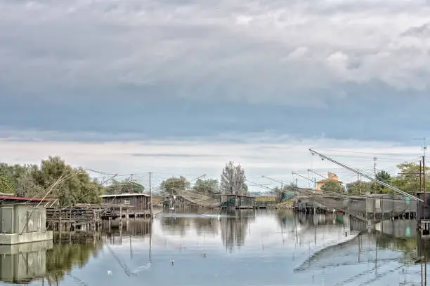 fishing trebuchets with nets on the water in Comacchio Italy