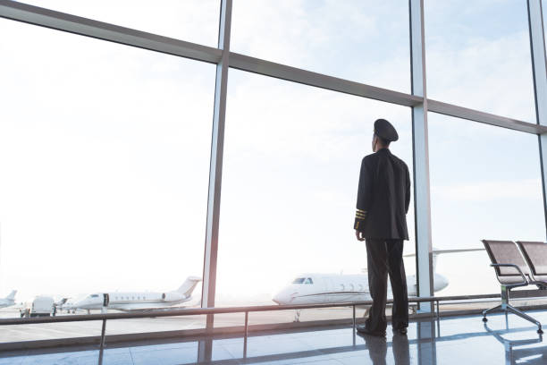 istock Adult aviator looking at planes 860381460