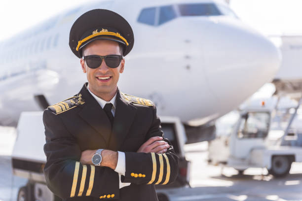 istock Hilarious smiling aviator locating near plane 860381726