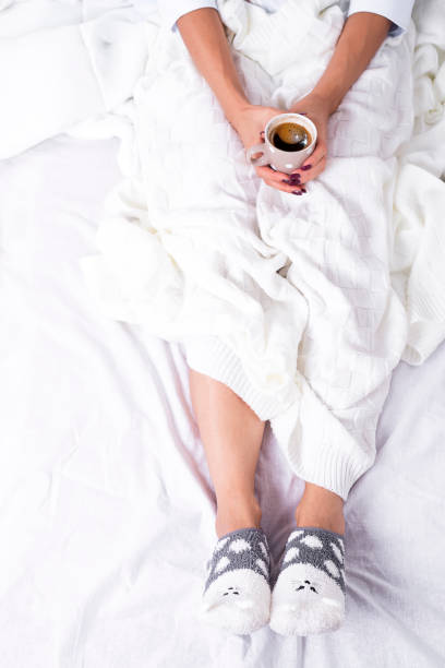istock hands holding hot cup of coffee 860381926