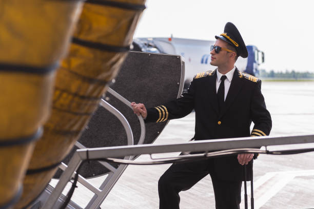 istock Assured aviator standing near plane 860382022