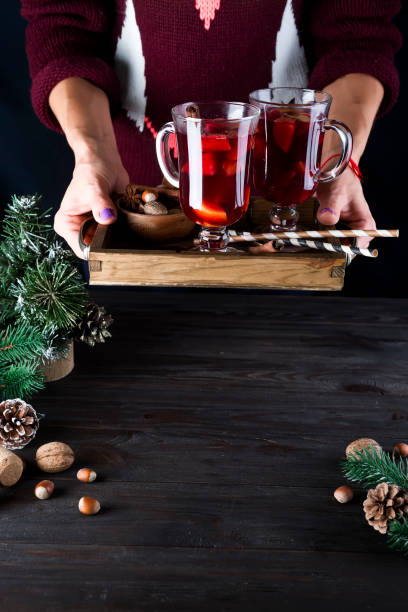 istock in female hands tray with hot mulled wine 860384126