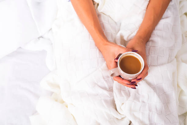 istock hands holding hot cup of coffee 860384246