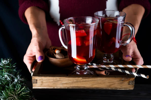 istock in female hands tray with hot mulled wine 860384422