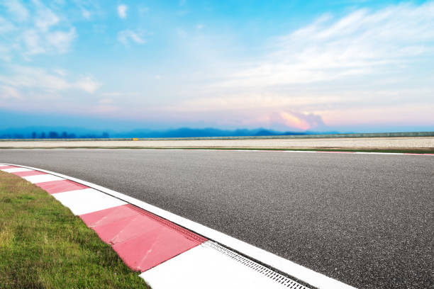 istock empty asphalt road with modern city near long river 860384720