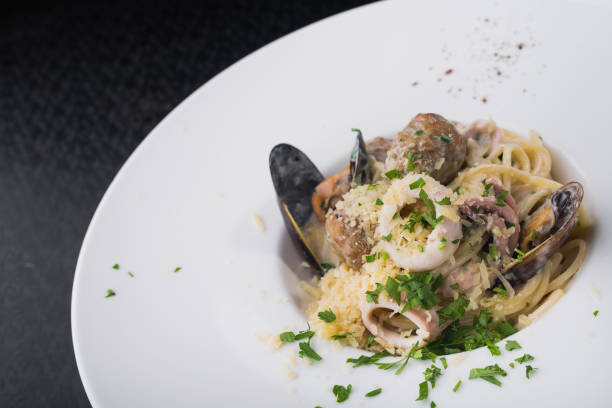istock seafood pasta with squid and mussels 860384904