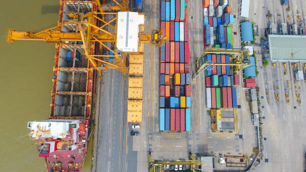 istock Logistics and transportation of Container Cargo ship and Cargo working crane bridge in shipyard 860386154