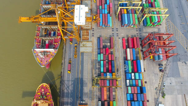 istock Logistics and transportation of Container Cargo ship and Cargo working crane bridge in shipyard 860387416