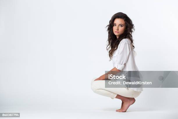 Beautiful Young Woman Stretching Her Legs She Is Wearing A White