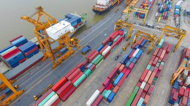 istock Logistics and transportation of Container Cargo ship and Cargo working crane bridge in shipyard 860388278