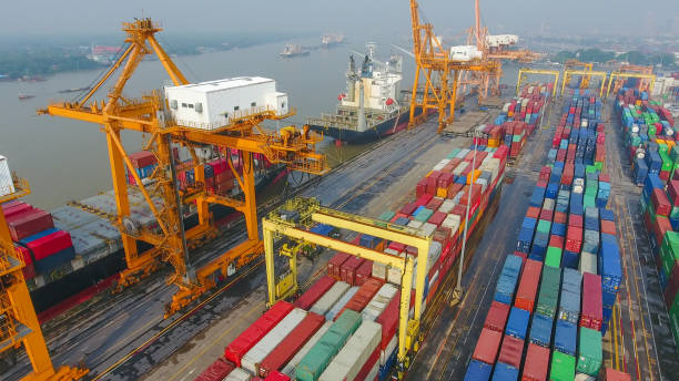istock Logistics and transportation of Container Cargo ship and Cargo working crane bridge in shipyard 860388982