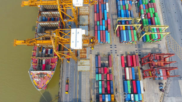 istock Logistics and transportation of Container Cargo ship and Cargo working crane bridge in shipyard 860388984