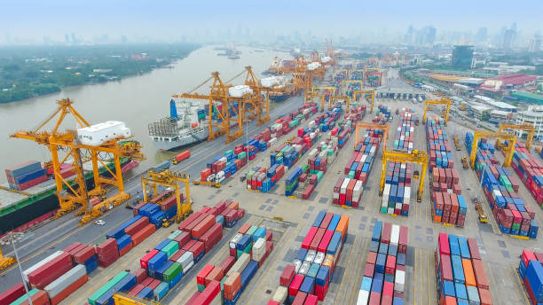 istock Logistics and transportation of Container Cargo ship and Cargo working crane bridge in shipyard 860389018