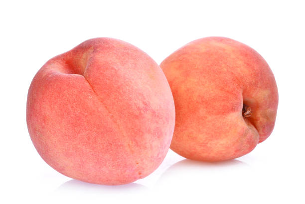 istock two whole of peach isolated on the white background 860389146