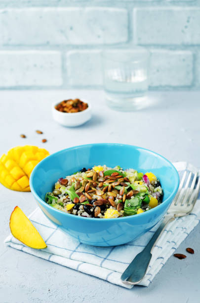 istock Mango black bean arugula pumpkin seed quinoa salad 860389226