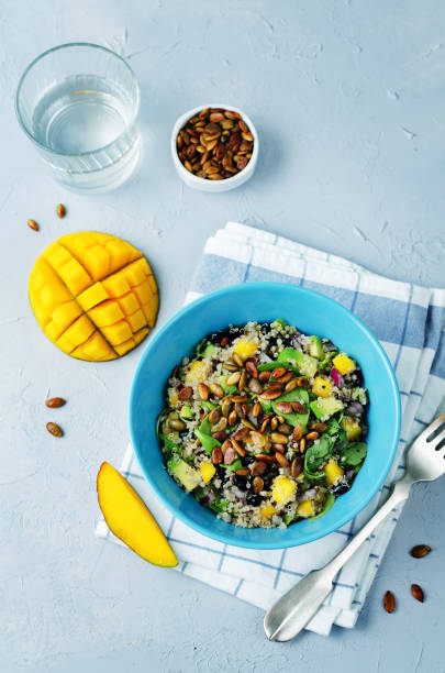 istock Mango black bean arugula pumpkin seed quinoa salad 860389230