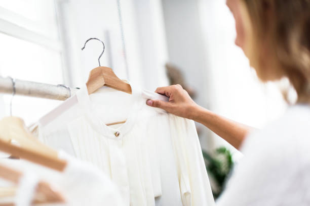 istock Woman checking out clothes 860389484