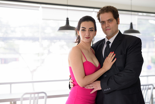 Portrait of Iranian couple relaxing together at home horizontal shot