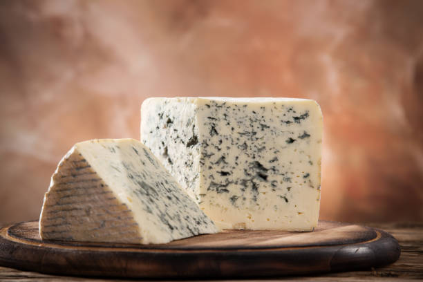 istock Blue cheese on wooden background 860407966