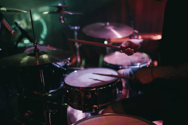 istock Drummer playing his drum kit on concert in club 860414390