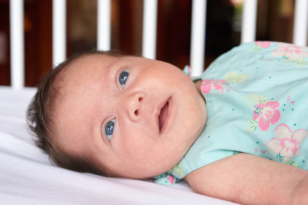 istock baby girl with blue eyes 860415682
