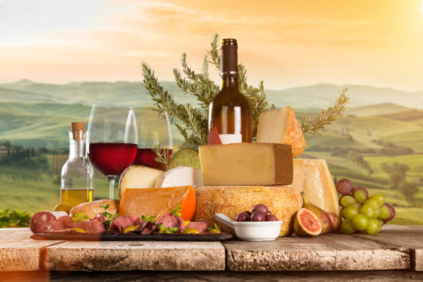 istock Delicious cheeses with wine on old wooden table 860416294