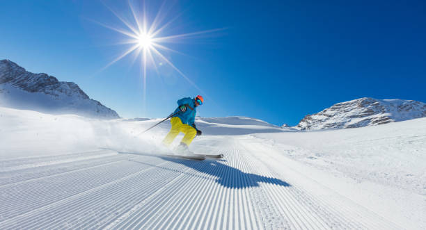 istock Young man skier running down the slope in Alpine mountains 860416554