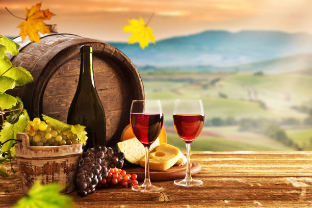 istock Delicious cheeses and wine on old wooden table 860416564
