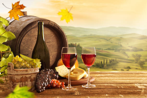 istock Delicious cheeses and wine on old wooden table 860416638