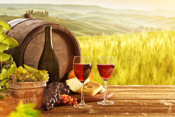 istock Delicious cheeses and wine on old wooden table 860416704