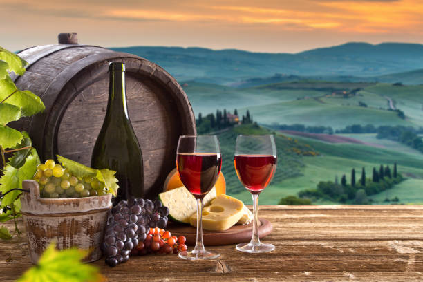 istock Delicious cheeses and wine on old wooden table 860416872