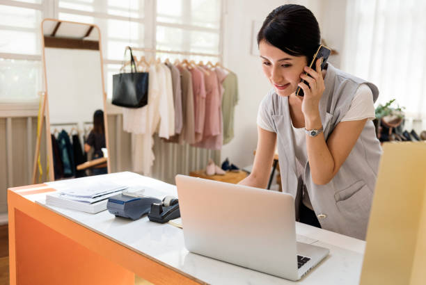 istock Woman working in a clothing shop 860419640