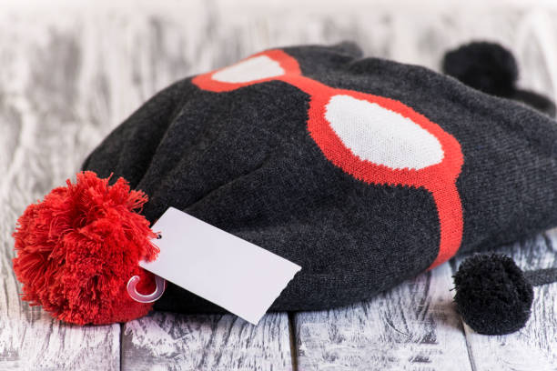 istock stylish knitted hat on a wood 860420600