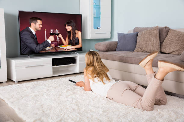 istock Woman Watching Movie On Television 860427886