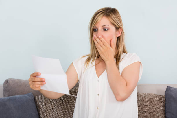 istock Sad Woman Reading Letter 860432078