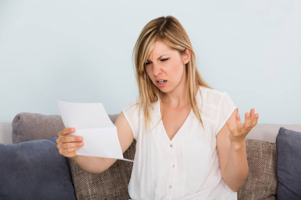 istock Sad Woman Reading Letter 860432324