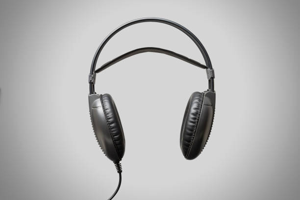 istock Black headphones on grey background 860435678