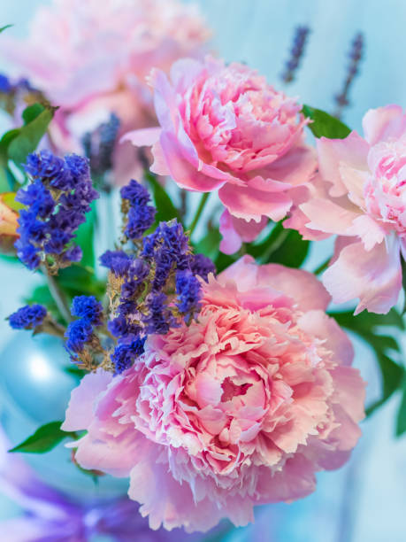 istock Beautiful pink peony and lavender flowers against blurred background. 860435890
