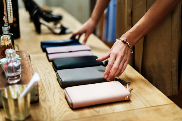 istock woman adjusting purses for sale 860440262