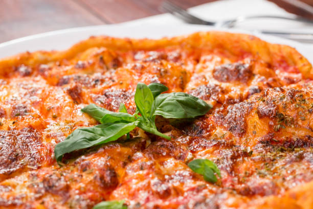 istock Italian pizza with mozzarella, tomato and basil 860443258