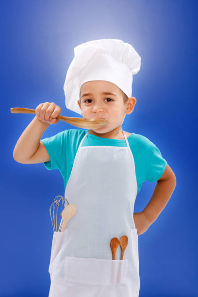 istock Little chef tasting food 860450298