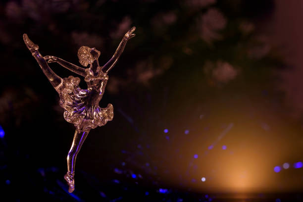 istock Glass ballet dancer on Dark background. Old style. Selective focus 860459332