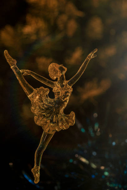 istock Glass ballet dancer on Dark background. Old style. Selective focus 860459418