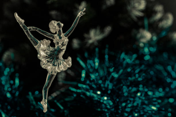 istock Glass ballet dancer on Dark background. Old style. Selective focus 860459606