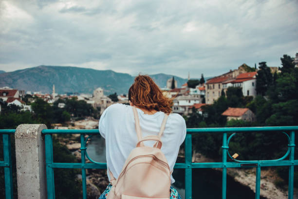 istock Young woman at bridge 860464902