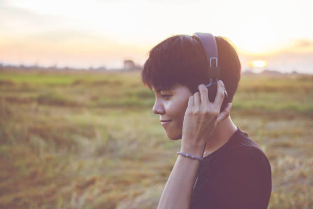 istock Teens are listening to music at close range with a light sunset background. 860465172