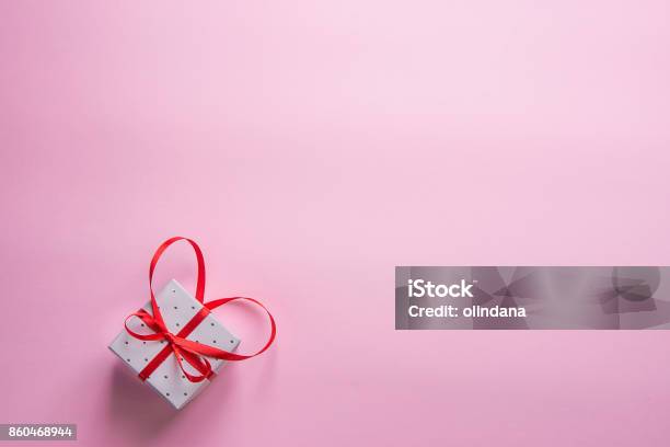Elegant Gift Box Tied With Red Ribbon With Bow In Heart Shape On Pink Background Valentine Wedding Mothers Day Birthday Women Copy Space Greeting Card Poster Template Stock Photo - Download Image Now