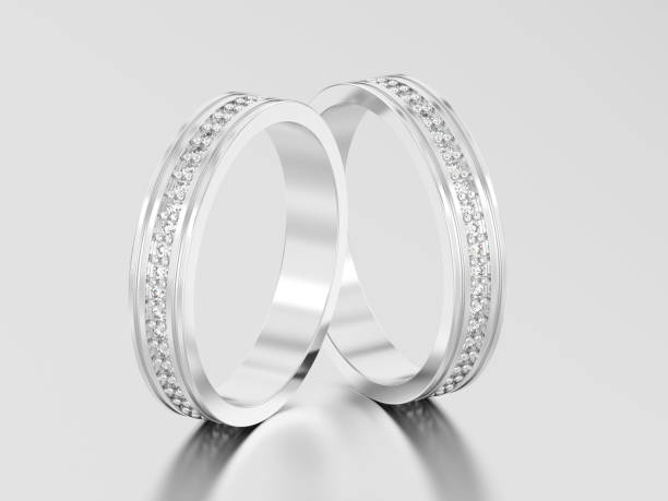 istock 3D illustration two white gold or silver engagement wedding band diamond rings with reflection and shadow 860472122
