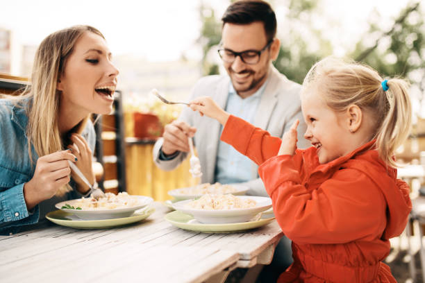 Family enjoying restaurant stock photo