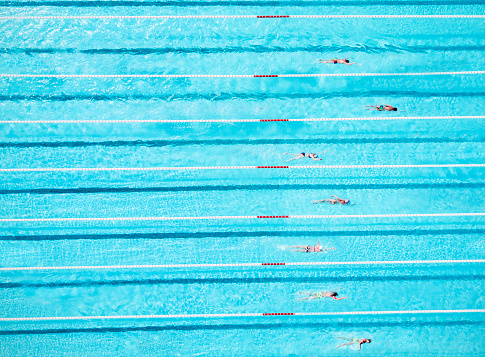 Aerial View of Swimmers in a Blue Pool